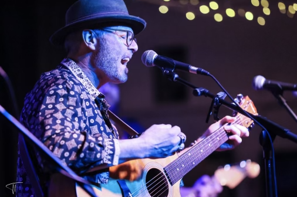 image of Chris Cullen singing with Guitar 1